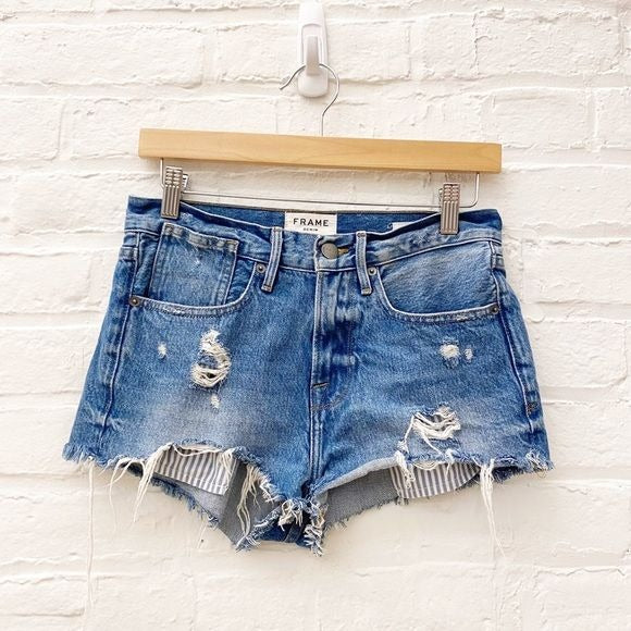 Frame || Le Stevie Distressed Denim Cutoff Shorts with Peeking Pockets Blue 24